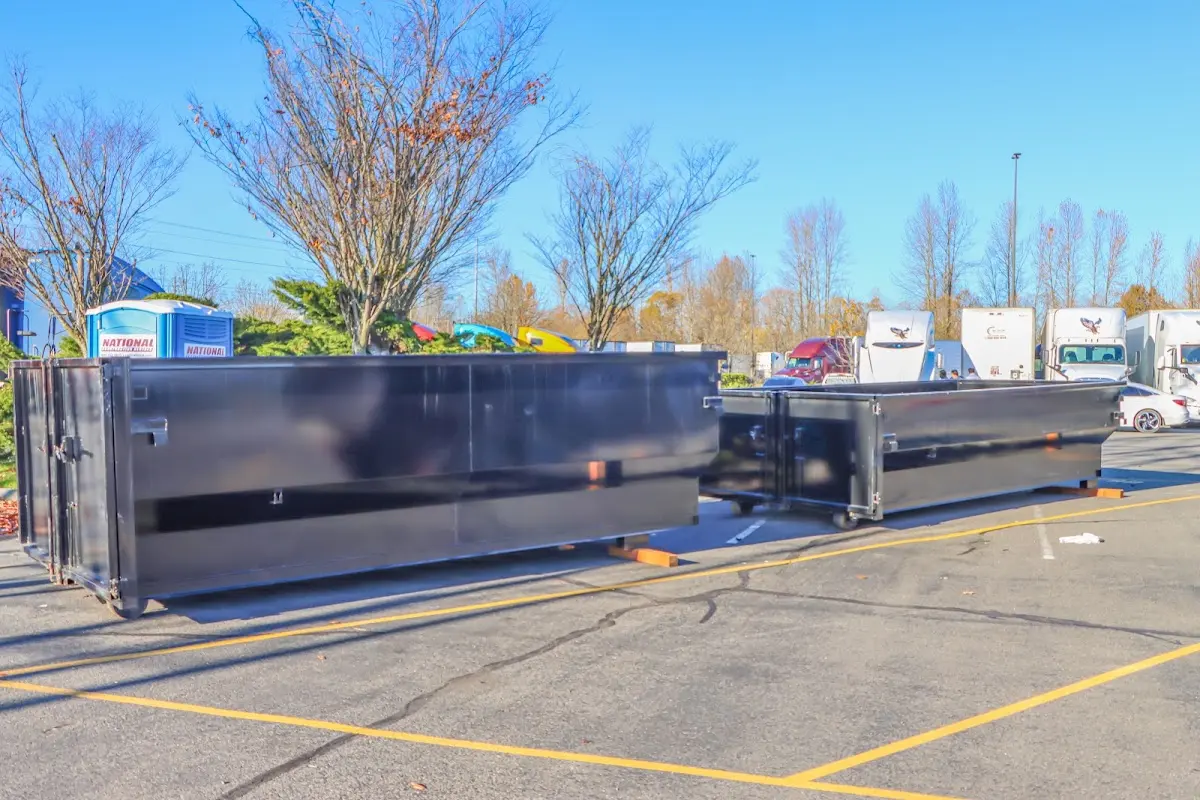 Professional dumpster rental service with roll-off container on residential driveway in Elk Grove Village